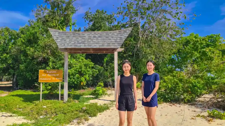 The natural beauty and white sand of Mataking Island with Coco Seaweed Resort in the Semporna archipelago.